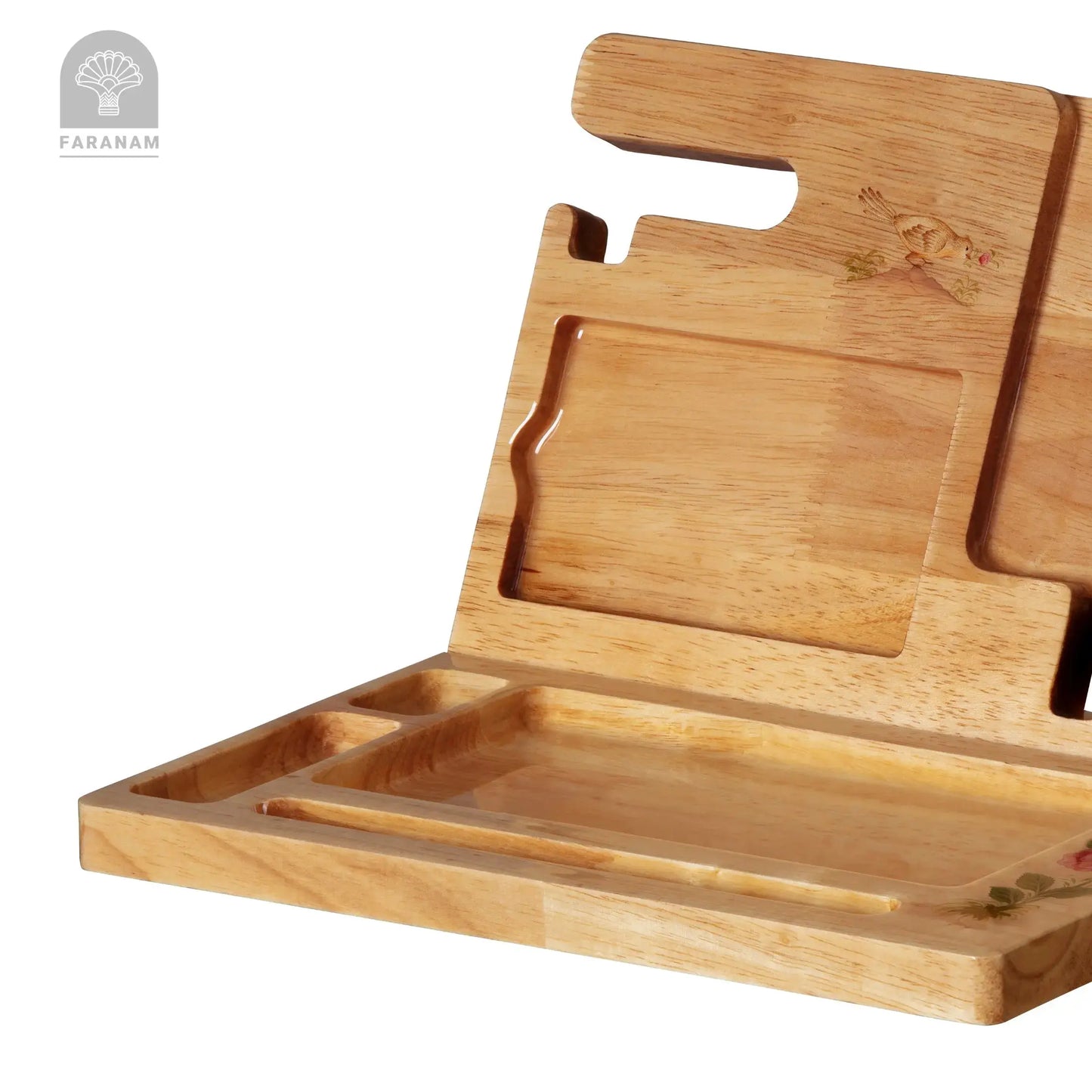 Wooden cutting board with multiple compartments on a white background